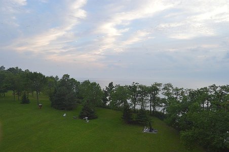 View from the top of the lighthouse looking over Lake Erie on a hazy night.